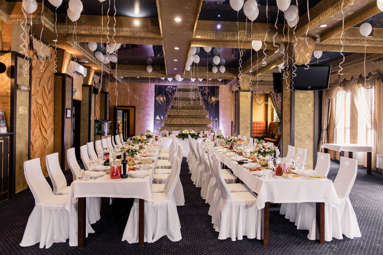 banquet table in a restaurant on a holiday with food and dri